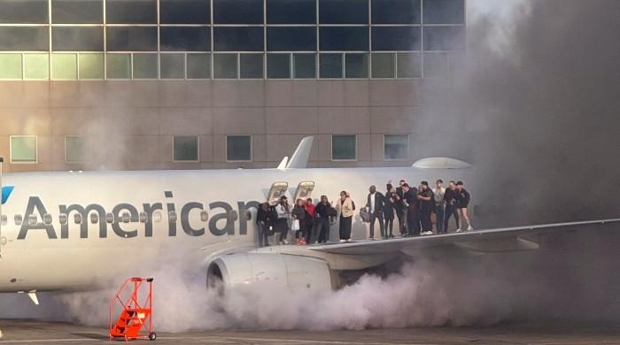 Fire aboard US airliner after diverted to Denver, 12 injured