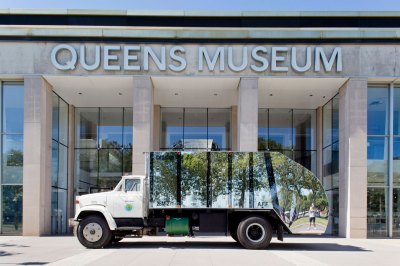A mirror garbage truck installed outside the Queens Museum. 