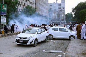 Police use water cannon to disperse protesters belonging to Sindh Employees Association outside the Press Club.