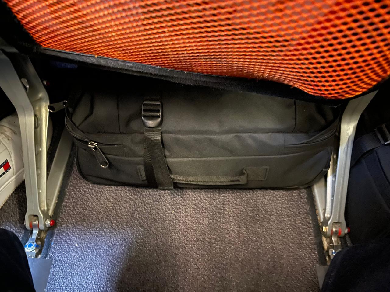 Bag under airplane seat.