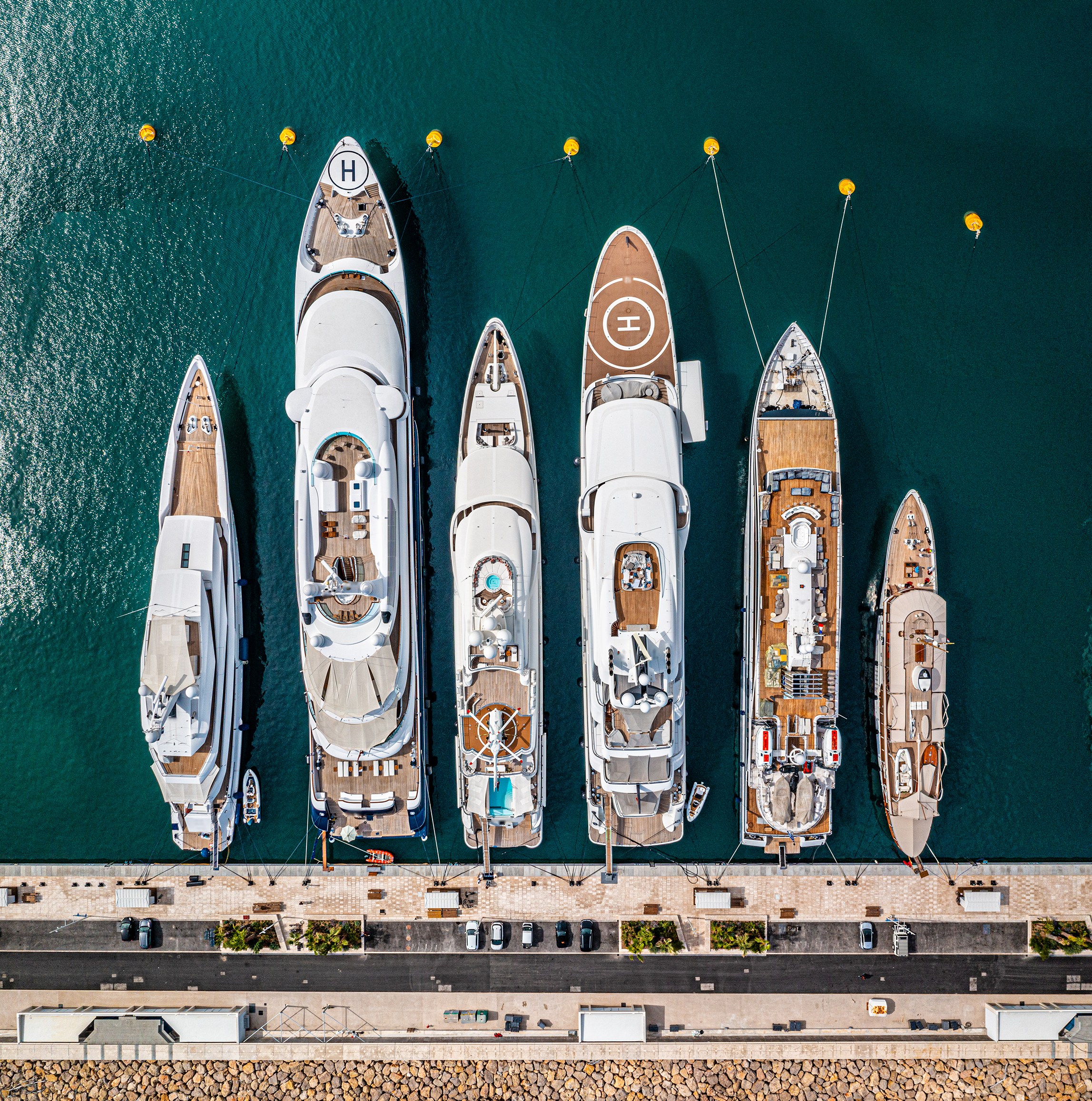 Row of luxury super yachts moored in Port Vauban, Antibes, Cote D'Azur, France