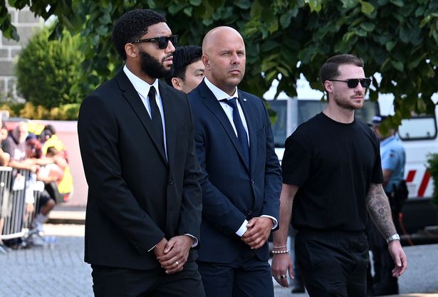 Arne Slot, Manager of Liverpool FC, arrives with players and coaching staff at a funeral held for Diogo Jota