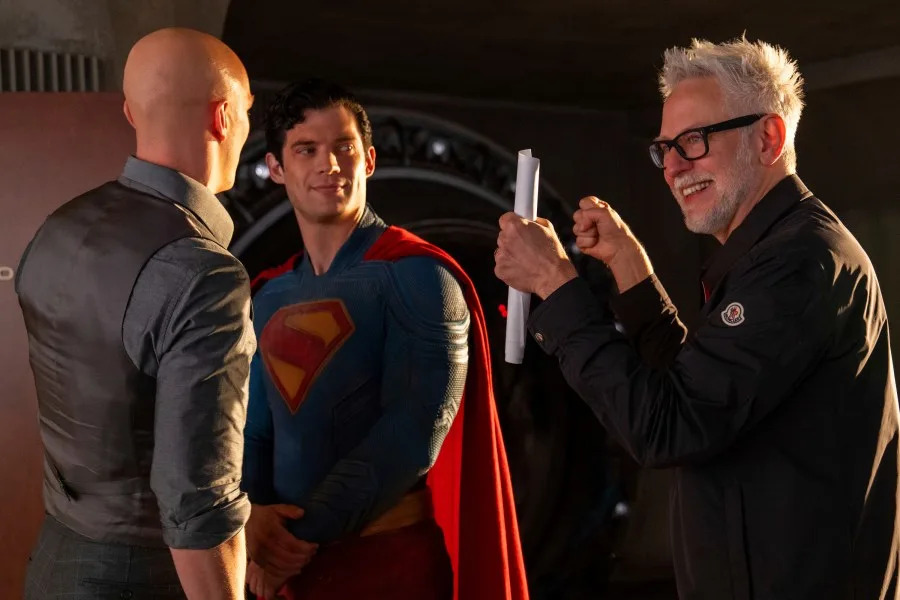 This image released by Warner Bros. Pictures shows Nicholas Hoult, left, David Corenswet, center, and director James Gunn on the set of "Superman." (Jessica Miglio/Warner Bros. Pictures via AP)