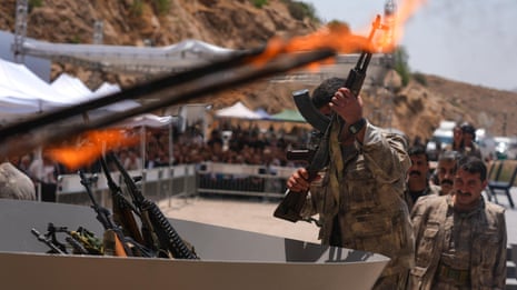 Kurdistan Workers’ party fighters burn weapons in disarming ceremony – video