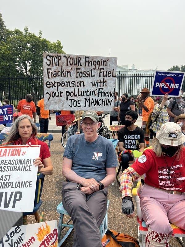 People protest against fossil fuels outside of the White House