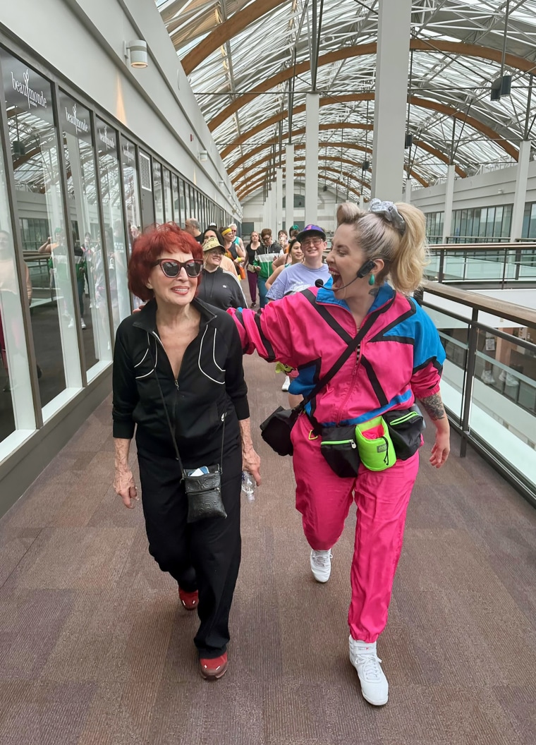 Leslie Kelinson (L) and Krista Catwood (R) lead the way in their walking group “Food Court 5000” at the Lloyd Center in Portland, Oregon. 