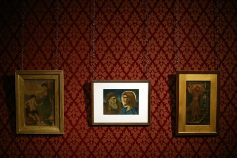 Getty Images William De Morgan titled 'Tobias and the Angel at the River Tigris', 'Christ and Peter' by Simeon Solomon and 'The Wine Press' by John Roddam Spencer Stanhope are pictured during a preview at Leighton House Museum in February 2016 