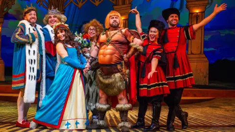 Andrew AB Photography The Legend Of Rooney's Ring - [L-R] Liam Tobin, Lindzi Germain, Emma Grace Arends, Keddy Sutton, John May, Latesha karisa, Adam McCoy - all in colourful medieval costumes on stage 