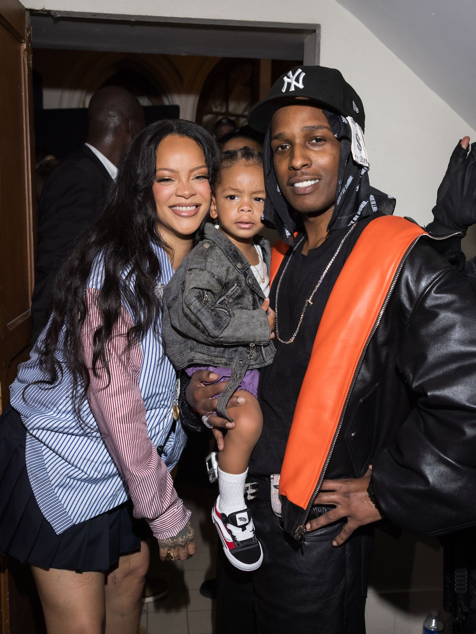 Image may contain AAP Rocky Rihanna People Person Clothing Coat Jacket Glove Footwear Shoe and Accessories
