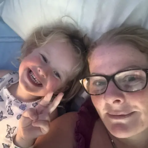 Supplied Selfie of Eliyah and Kelly lying on a bed
