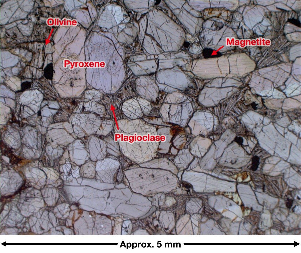 This optical microscope photograph of Yamato 000593 shows that olivine in the rock’s interior has been partially transformed into clay minerals. (Courtesy the National Institute of Polar Research)