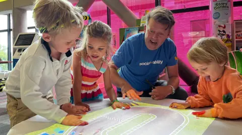 BBC Children with John Ramsay playing on the interactive storytelling projector