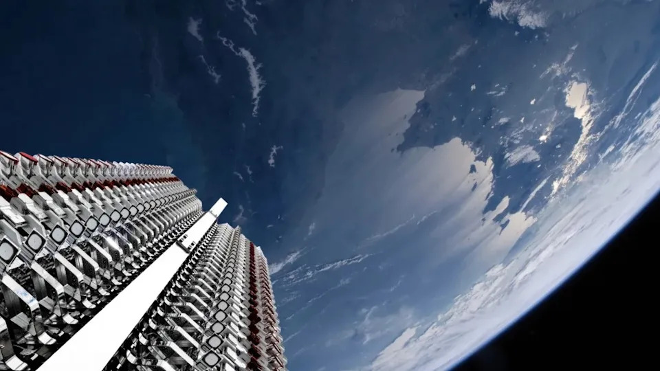 A tower full of satellites looks up toward the sky.