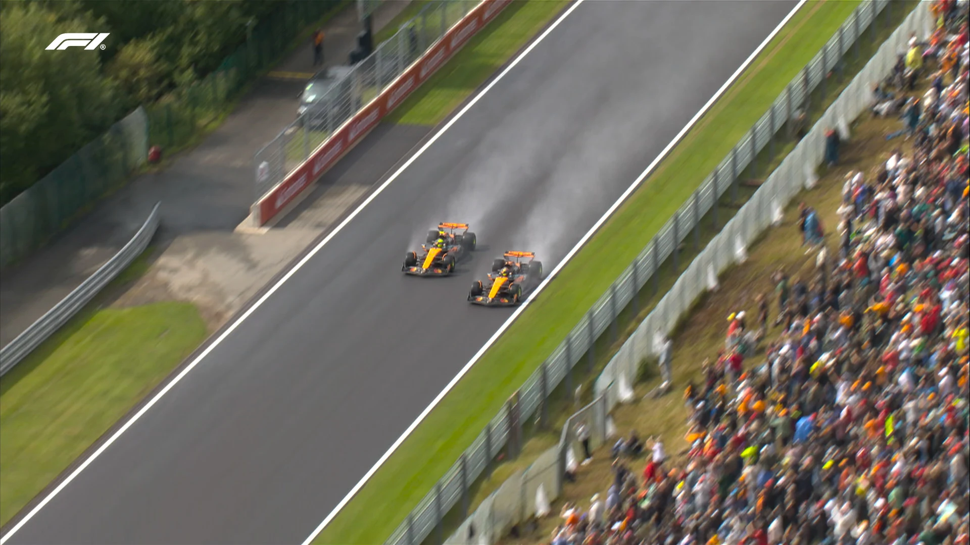 Oscar Piastri jumps Lando Norris on opening racing lap in delayed Belgian Grand Prix