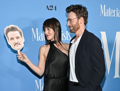 Dakota Johnson and Chris Evans pose at the premiere of 'Materialists' with a cut-out of Pedro Pascal (who couldn't attend), in New York, June 7, 2025.