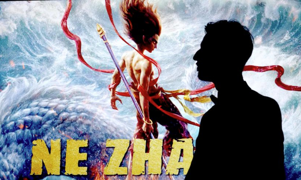 A man walks past a screen showing a poster of the Chinese animated film Ne Zha 2 before a preview screening at the BFI IMAX theater in London, Britain, on March 14, 2025. (Xinhua/Li Ying)