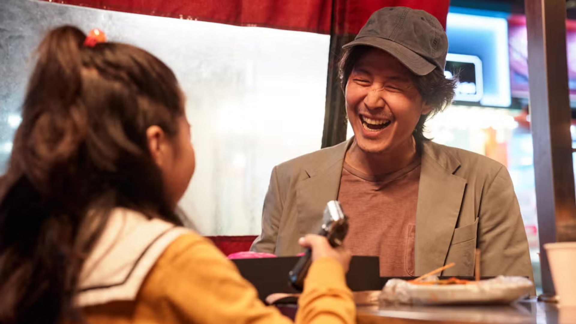 Gi-hun with his daughter in Season 1 (Image via Netflix).