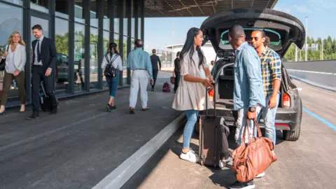 Getty Images Passengers dropped at front of airport terminal 