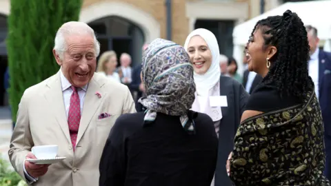PA Media King Charles meets staff during a visit to the Oxford Centre for Islamic Studies in Oxford.