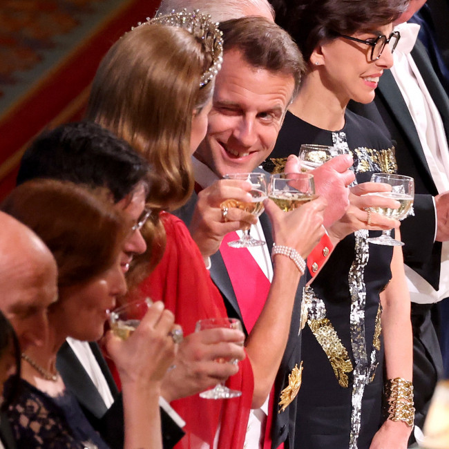 French President Emmanuel Macron winks at Catherine, Princess of Wales during banquet