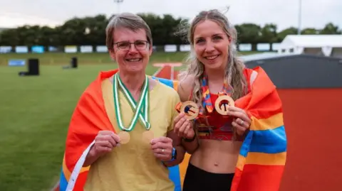 Orkney Photographic Two women holding medals
