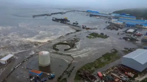 Geophysical Survey Of The Russian Academy Of Sciences via EPA Aerial shot showing brown ocean water flooding into industrial land