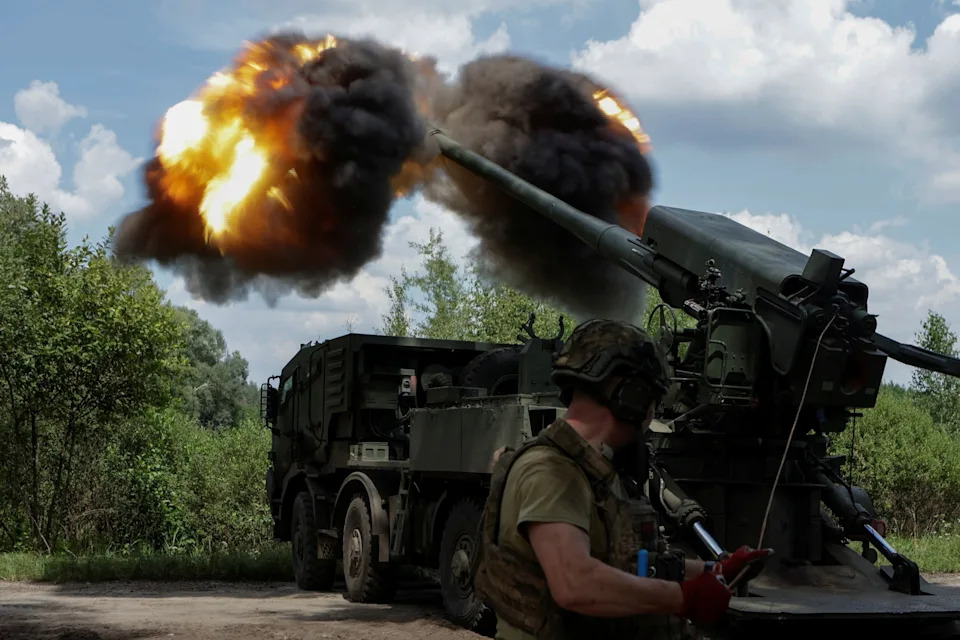 Sofiia Gatilova/Reuters - PHOTO: Ukrainian gunners fire a 2S22 Bohdana self-propelled howitzer towards Russian frontline positions in the Kharkiv region of Ukraine on July 27, 2025.
