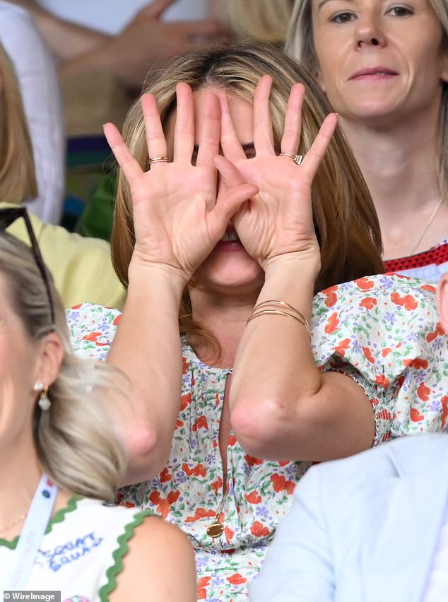 An excited Cat could barely look at the Centre Court action, at one point covering her face with her hands