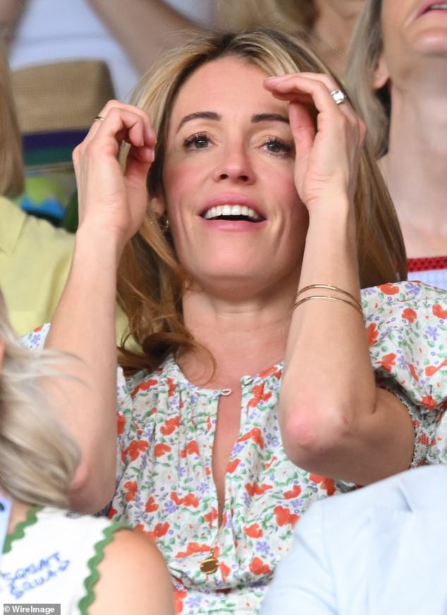 The TV star looked gorgeous in her pretty floral dress for her sporting afternoon