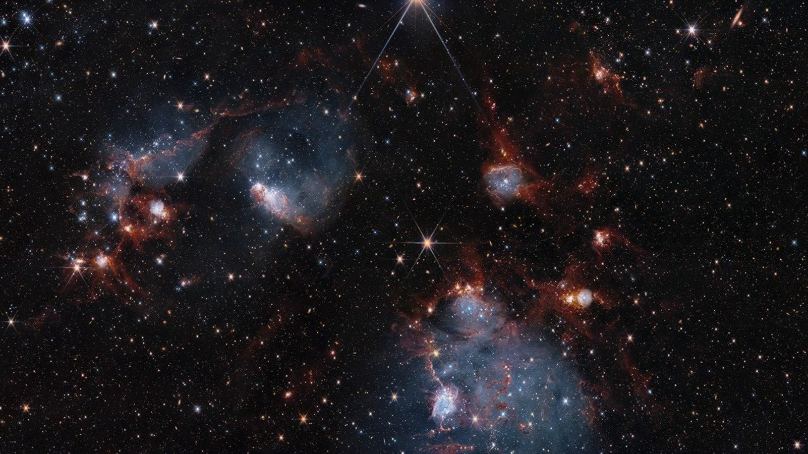 Hubble and James Webb Space Telescopes show two sides of star cluster duo photo of the day for July 10, 2025