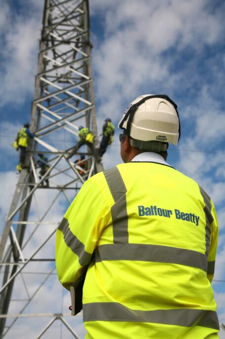Balfour Beatty team construction an electricity pylon in Corby