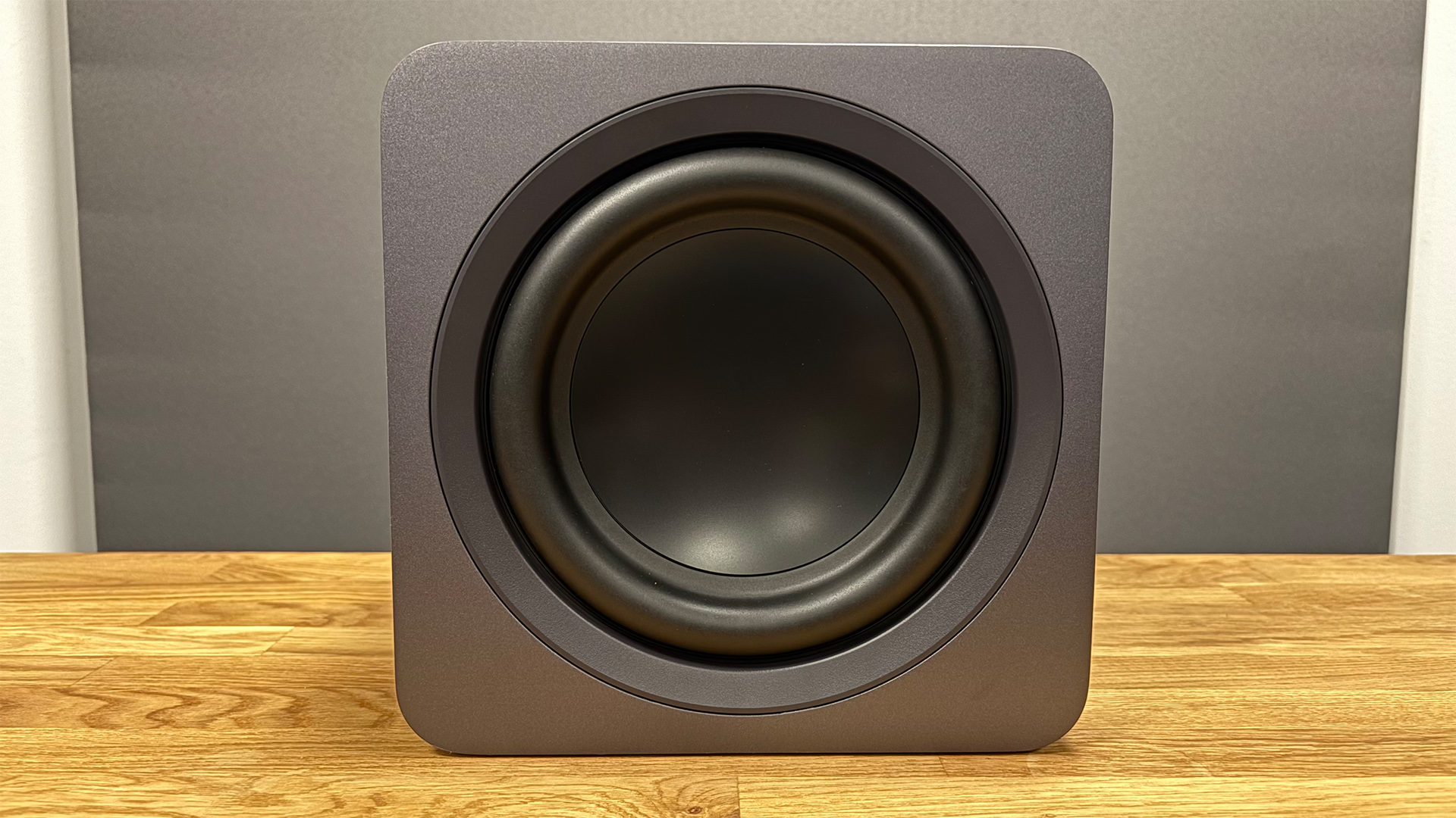 Samsung HW-Q990F soundbar package subwoofer on wooden AV rack