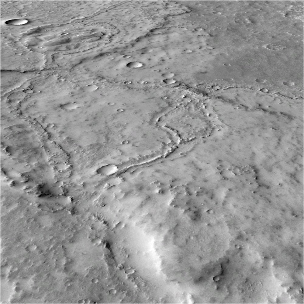 This MRO CTX image gives an oblique view of part of a system of FSRs in Noachis Terra. It shows river tributaries that were probably active at the same time. The rivers meandered, and there are areas where the river banks burst and deposited fine layers of sediment. At the top of the image is a really clear example of an area where two FSRs intersect with an infilled crater. This is likely where the river flowed into the crater, filling it up and then breaching the other side to continue through the crater and down to the bottom of the image. CTX image: MurrayLab_V01_E020_N-20_Mosaic. Image Credit: NASA/JPL/MSSS/The Murray Lab. Licence type: Attribution (CC BY 4.0)