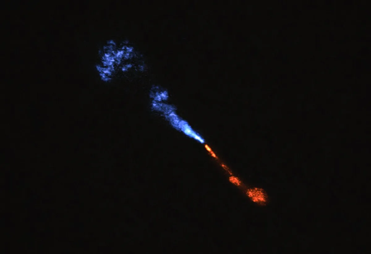 Jets of silicon monoxide blowing away from baby star HOPS-315. The image was obtained with the with the Atacama Large Millimeter/submillimeter Array (ALMA). Credit: ALMA(ESO/NAOJ/NRAO)/M. McClure et al.