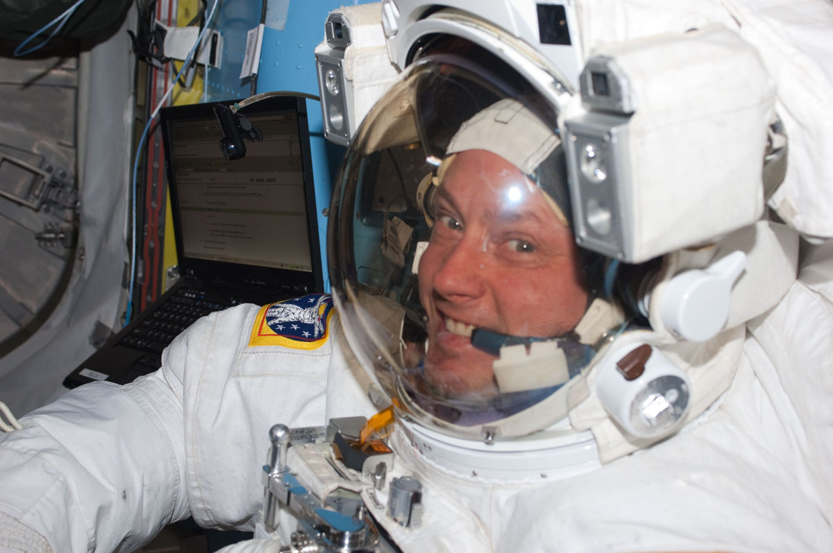 NASA astronaut Michael Fincke, STS-134 mission specialist, attired in an Extravehicular Mobility Unit (EMU) spacesuit, is pictured in the Quest airlock of the International Space Station prior to the start of the mission's third spacewalk on May 25, 2011. 