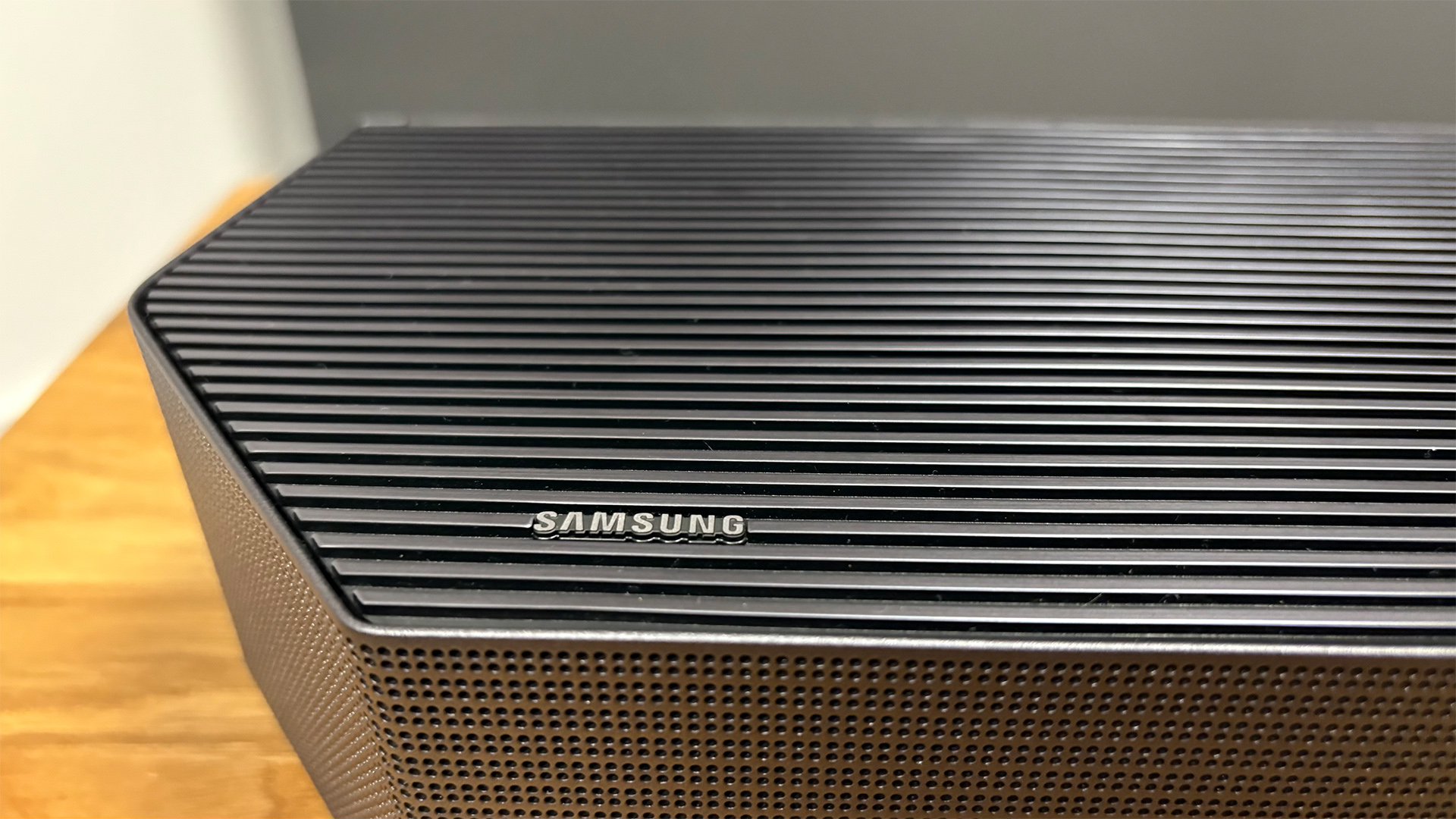 Samsung HW-Q990F soundbar package detail of end of soundbar and Samsung logo