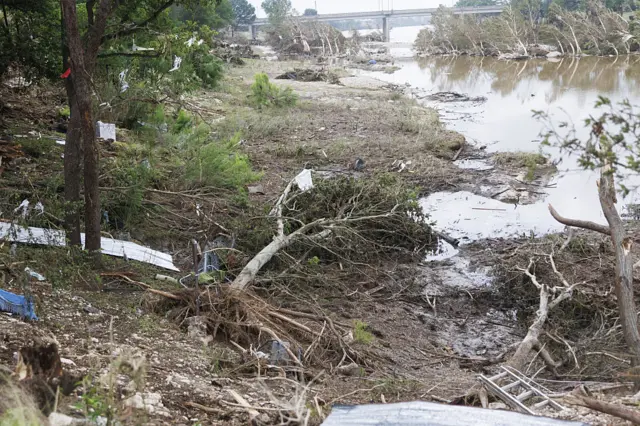 Debris is seen along the Guadalupe River in Texas following deadly floods
