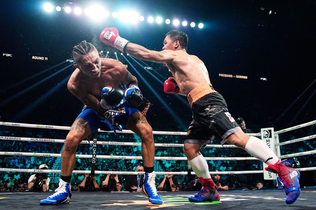 Mario Barrios, left, ducks a punch from Manny Pacquiao.