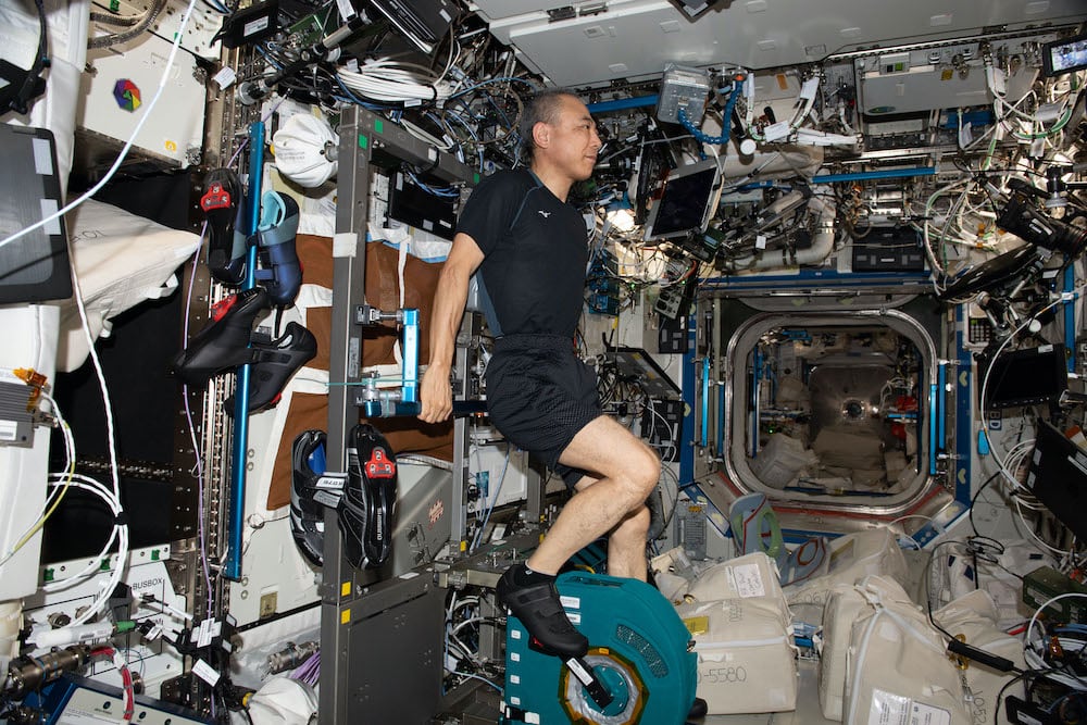 JAXA (Japan Aerospace Exploration Agency) astronaut Satoshi Furukawa pedals on the upgraded CEVIS system to maintain health and fitness during space missions. (Credit : NASA)