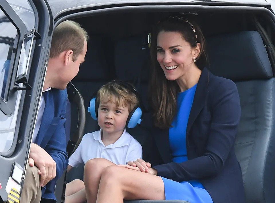 Prince George in a helicopter with his parents. / Samir Hussein / Samir Hussein