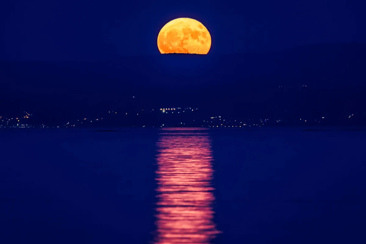 The July full Moon, known as the 'Buck Moon', doesn't rise very high above the horizon. This image shows it above Split, Croatia on 3 July 2023. Photo: Zvonimir Barisin/PIXSELL/DeFodi Images via Getty Images
