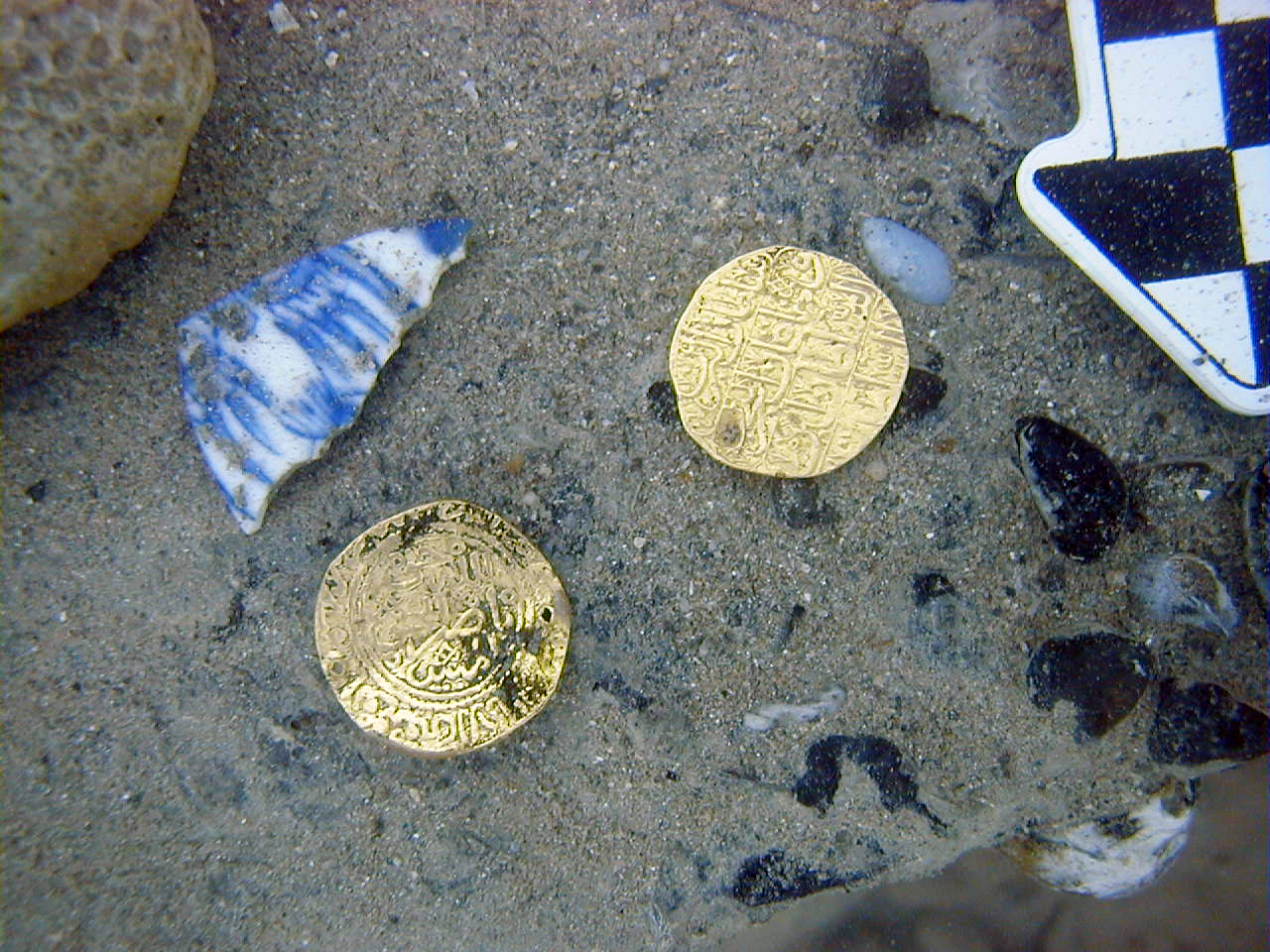 Gold coins and fragments of porcelain