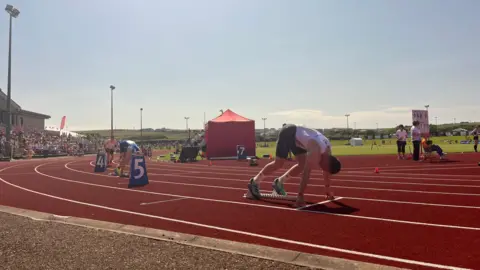 Running track, with runner pictured about to start running