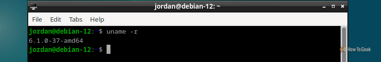 Debian 12 LXDe terminal open with the uname command showing the kernel version, which is at 6.1.