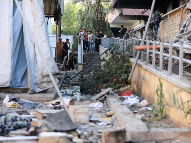 Palestinians inspect the damage at a school sheltering displaced people, following an overnight Israeli airstrike, in Gaza City, July 3, 2025. Photo: REUTERS