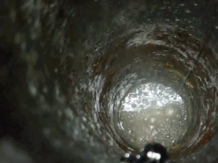 bubbles moving through a grey tunnel