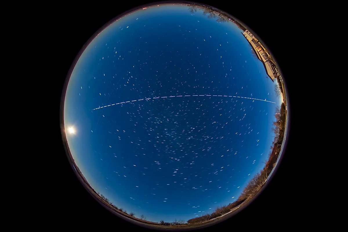 Can you see the Buck Moon and the Space Station on the same night? This fish-eye lens image shows the International Space Station passing overhead, 5 October 2017, with the full Moon rising in the east, left of the image. Photo by Alan Dyer/VW Pics/UIG via Getty Images