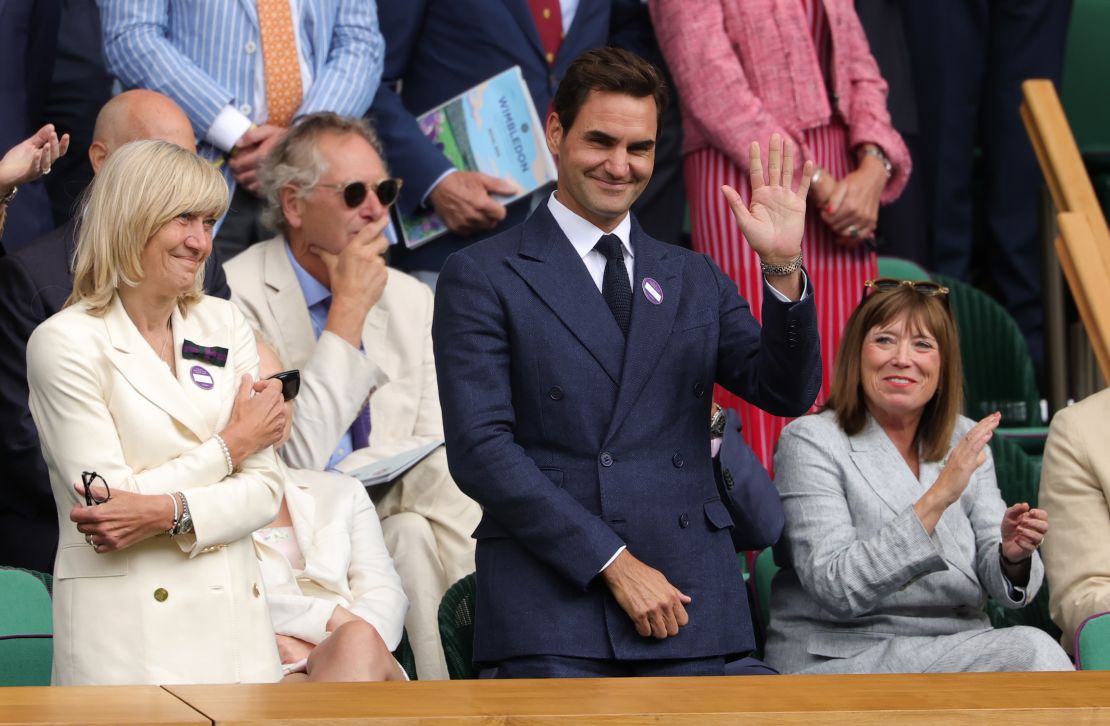Roger Federer waved from the Royal Box as Djokovic celebrates his victory.