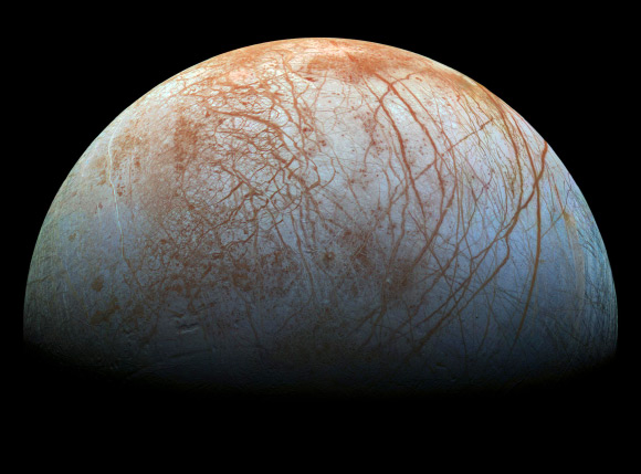 The surface of Europa looms large in this newly-reprocessed color view; image scale is 1.6 km per pixel; north on Europa is at right. Image credit: NASA / JPL-Caltech / SETI Institute.