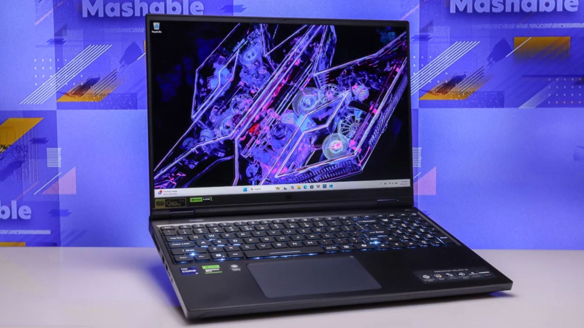 acer predator helios 16 on a table against a purple background that says